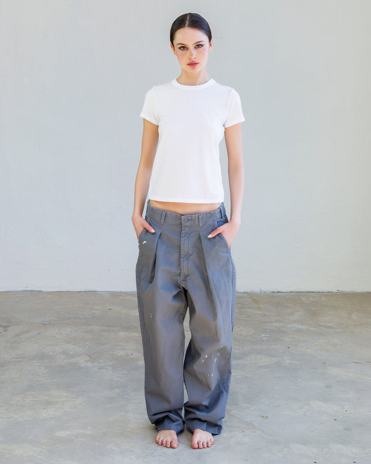 Alessi Fine Jersey Tee - Pearl worn with loose-fitting gray pants, showcasing a casual, modern look.