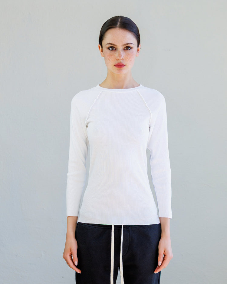 Aria Rib Raglan Tee- Pearl model showcasing slim fit and bracelet-length sleeves against a neutral background.