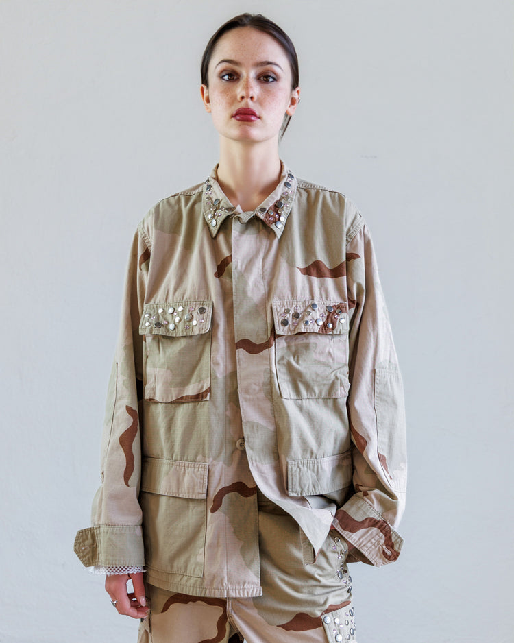 Austin Studded Twill BDU Unisex Jacket - Desert worn by model, showcasing its military-inspired design and studded collar.