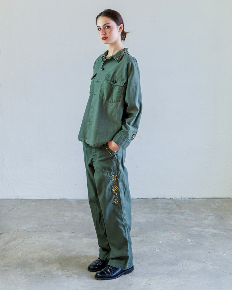 Wells Studded Sateen Women's Baker Pant - Army worn with matching shirt in a minimalist studio setting.