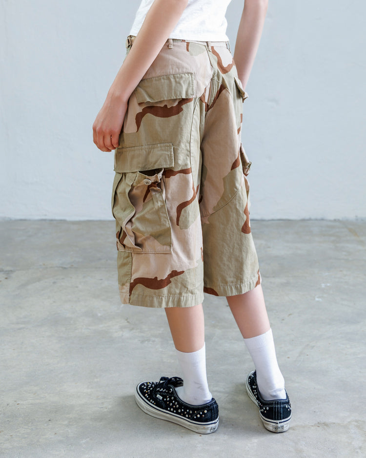 Jesse Twill Unisex Cargo Short - Desert showcased from the back, featuring military-style camouflage and a wide leg silhouette.