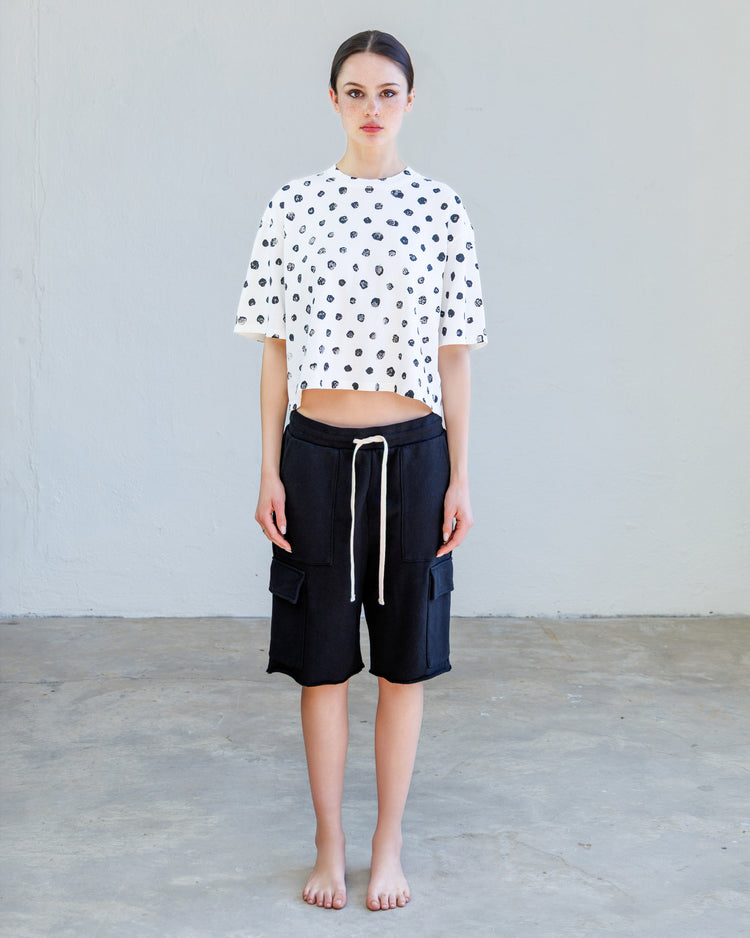 Knox Heavy Jersey Tee - Pearl Broken Dot worn with black shorts on a model, showcasing a relaxed fit and cropped style.