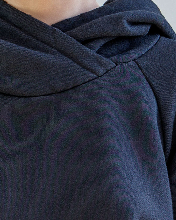 Close-up of the Lisse Loop Terry Hoodie - Black showcasing the oversized double-layer hood and soft fabric texture.