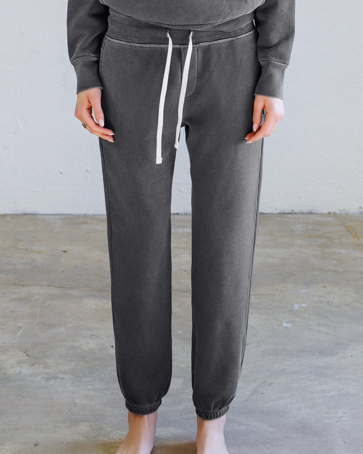 Sayde Loop Terry Sweatpant - Aged Black showing light distressing and slim fit on a model.