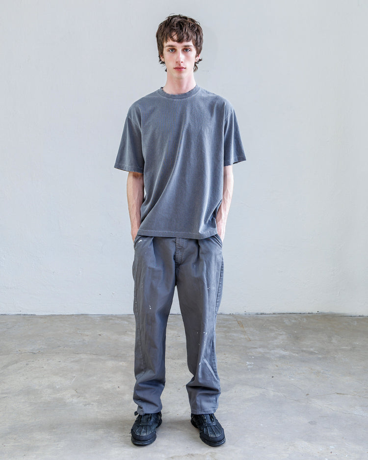 Turner Pleated Twill Unisex Trouser - Cement Workshop showcased on model wearing relaxed fit in gray.