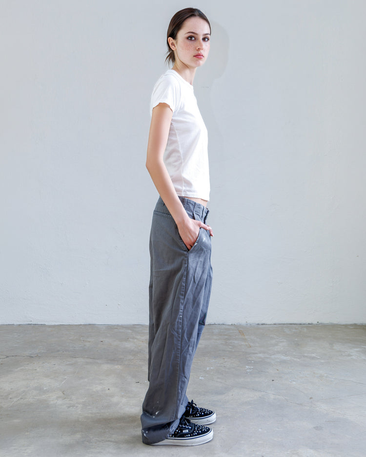Turner Pleated Twill Unisex Trouser - Cement Workshop worn by model showcasing relaxed fit and pleated design.
