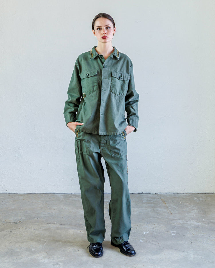 Wells Studded Sateen Women's Baker Pant - Army worn by a model in a studio setting.