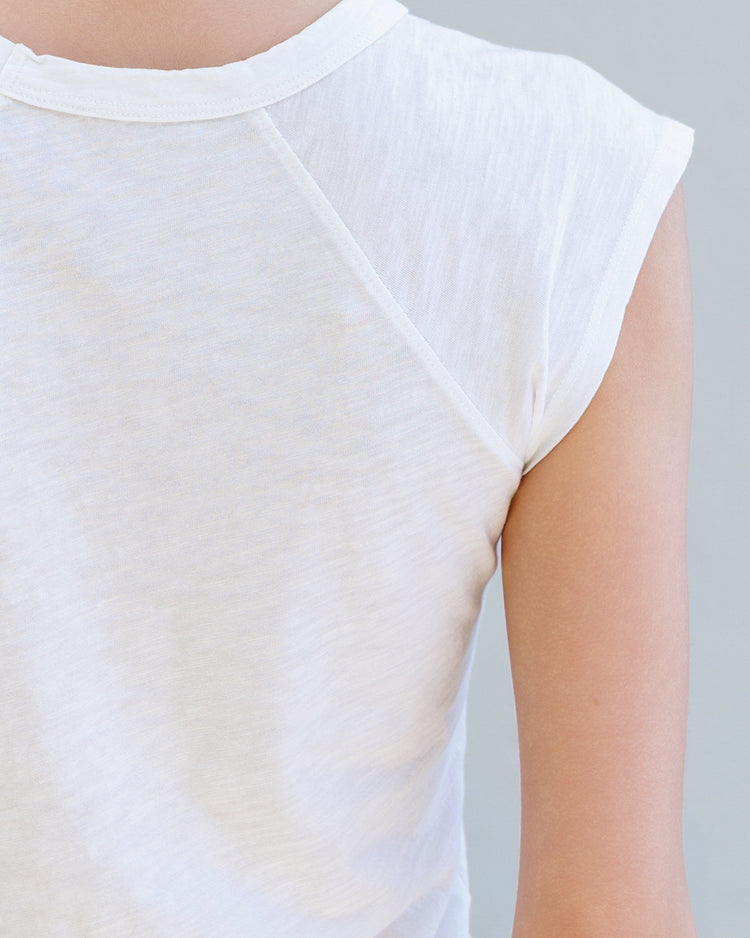 Back view of the Chloe Slub Jersey Muscle Tee - Pearl featuring raglan cap sleeves and soft cotton texture.