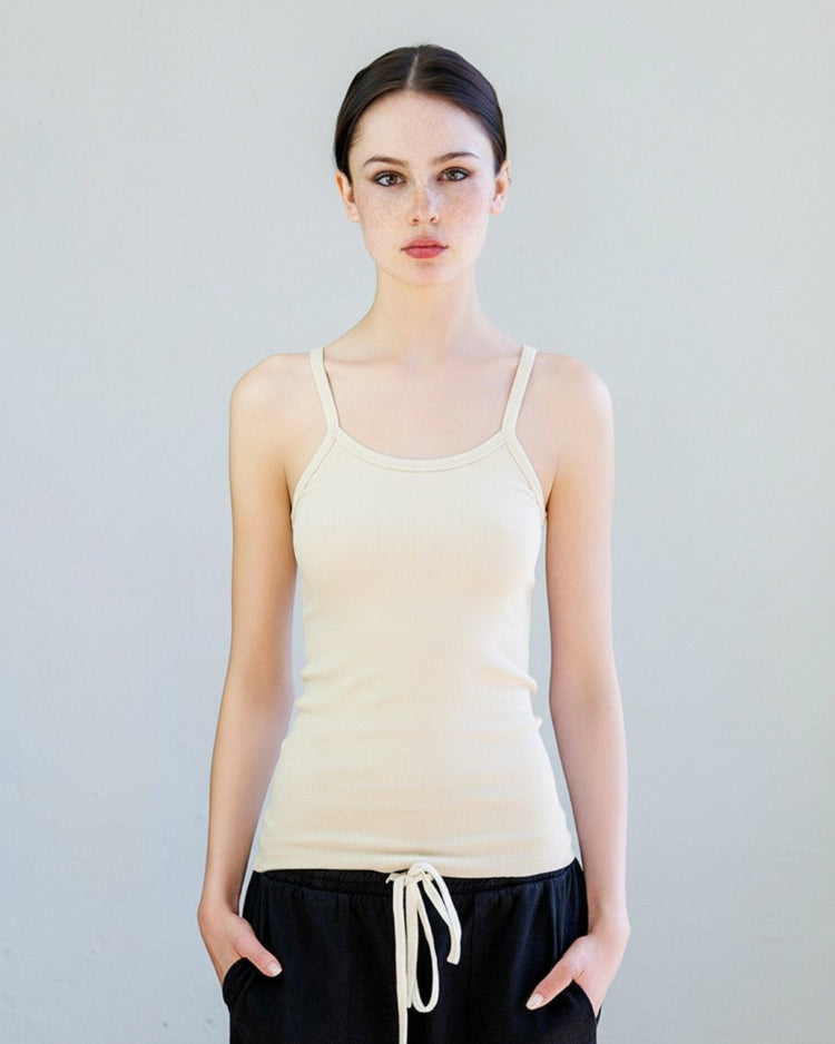 Model wearing the Kai Rib Cami Tank - Drift, showcasing its slim fit and spaghetti straps.