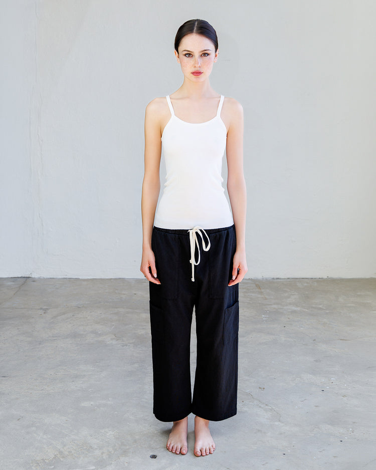 Nova Heavy Jersey Lounge Pant - Black displayed on model with white tank top and bare feet.