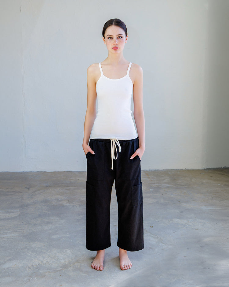 Model wearing Nova Heavy Jersey Lounge Pant - Black with a white tank top, showcasing relaxed and stylish loungewear.